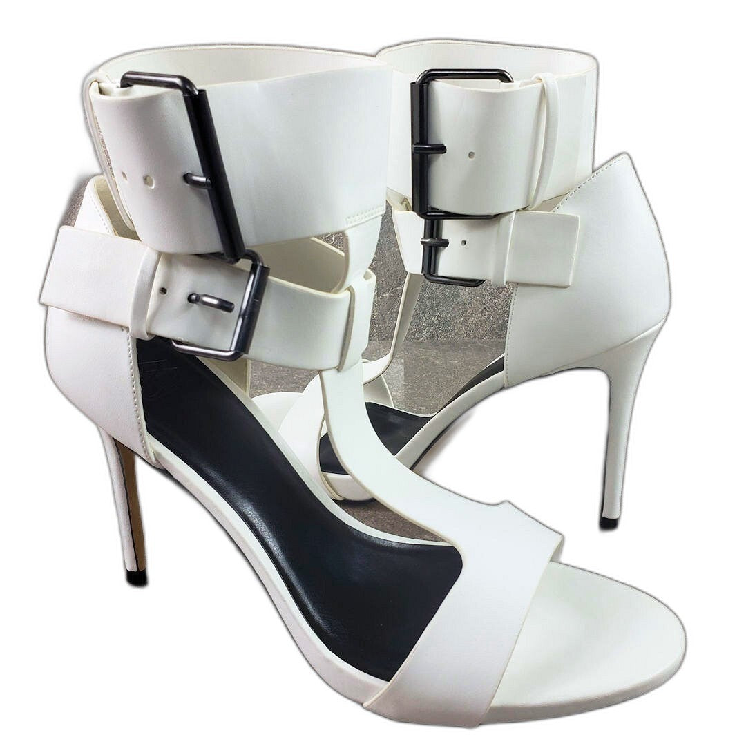 AAJ by Aminah Zahra white double buckle T-strap stiletto sandals - front