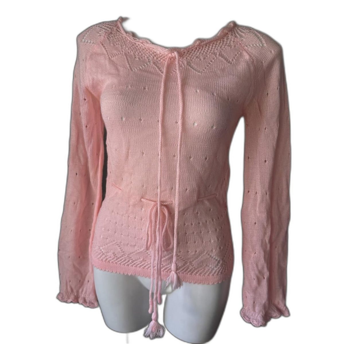 Vintage pink knit sweater with tie front and tassels - front on mannequin