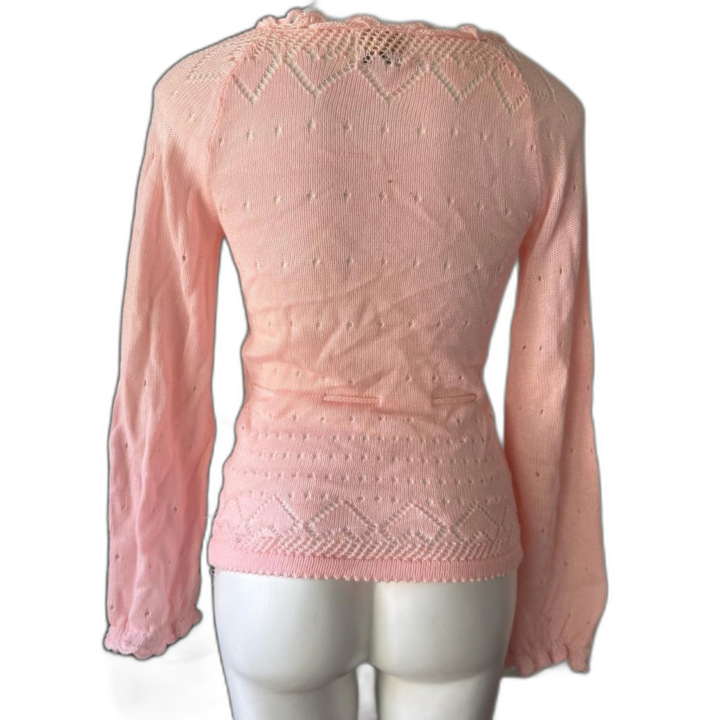 Vintage pink knit sweater with tie front and tassels - back on mannequin